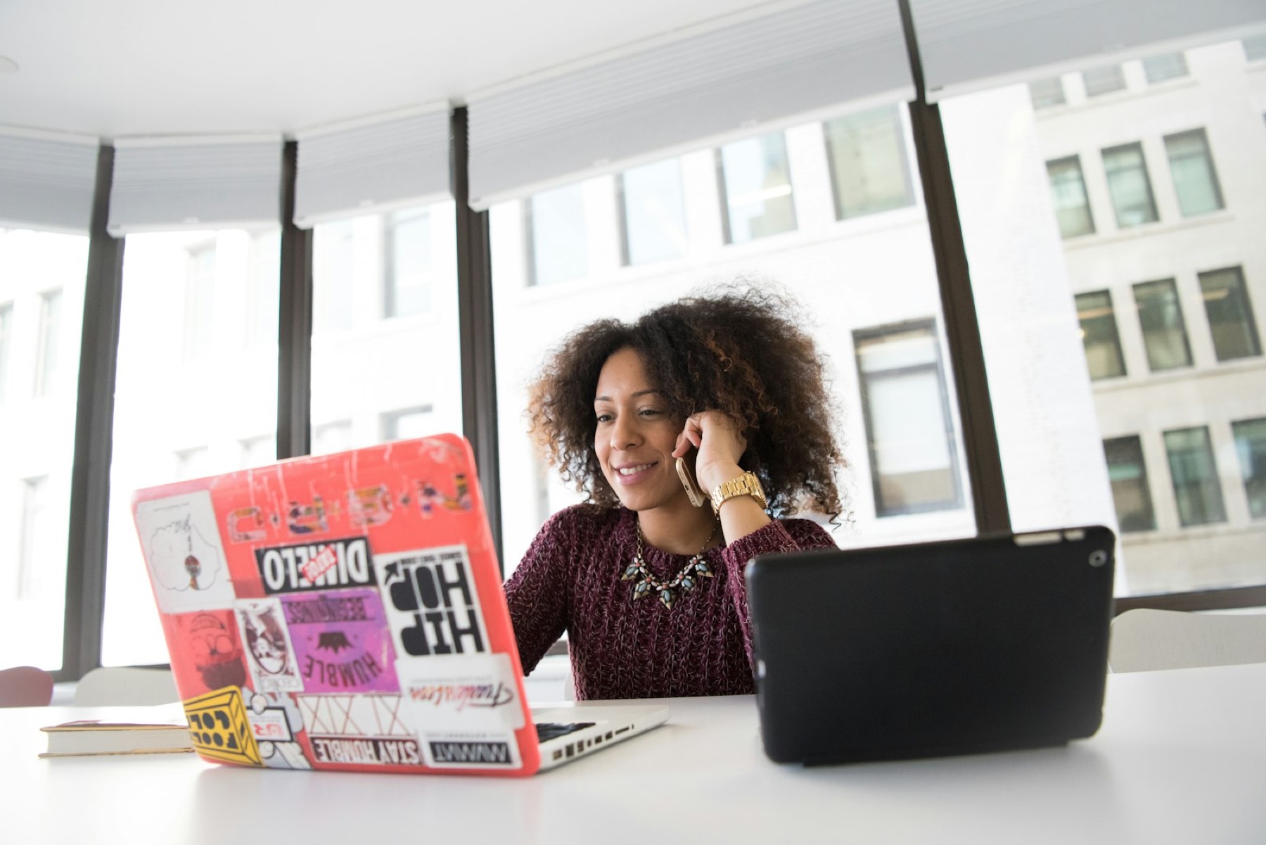 Woman working on a laptop in an office
