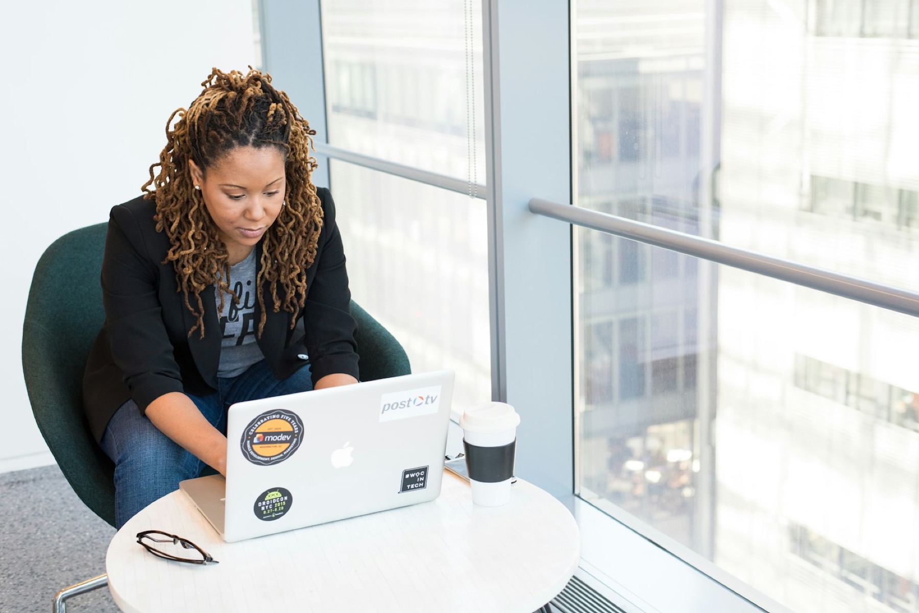 Media buyer reviewing campaign options on a laptop